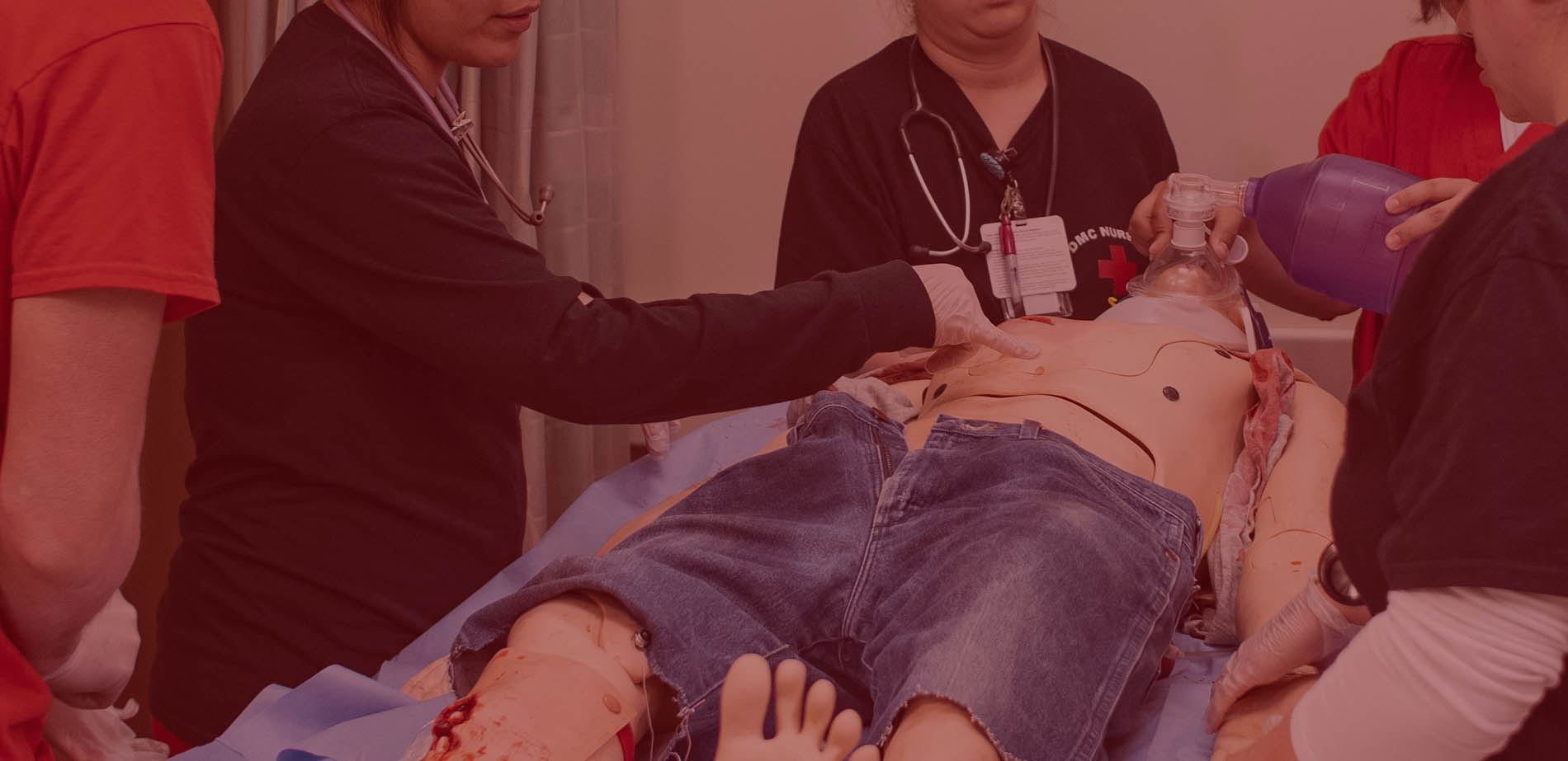 closeup of nursing students training with mannequin