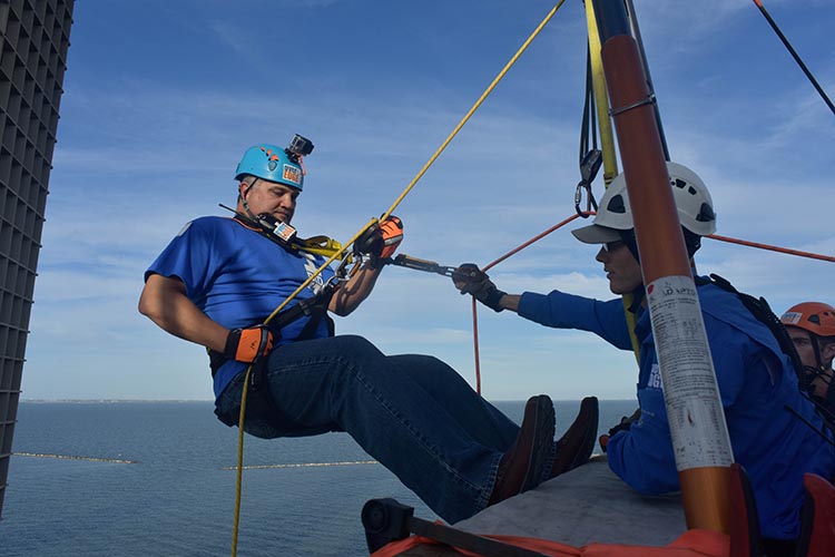 Dr. Escamilla rappels from the Holiday Inn Marina