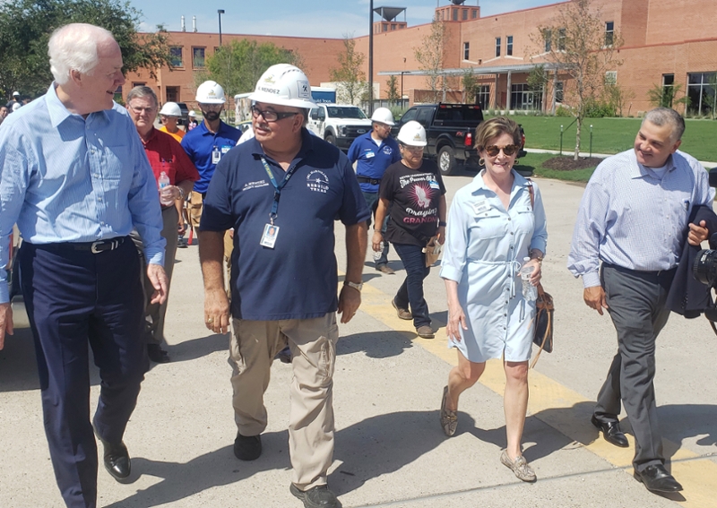 Senator John Cornyn walking alongside Rebuild Texas Program Manager Arnold Mendoza, Regent Carol Scott and President and CEO Mark Escamilla, Ph.D. McCampbell are sworn into office following the 2016 election
