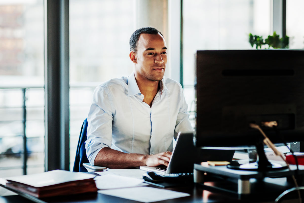 Business man works on his computer