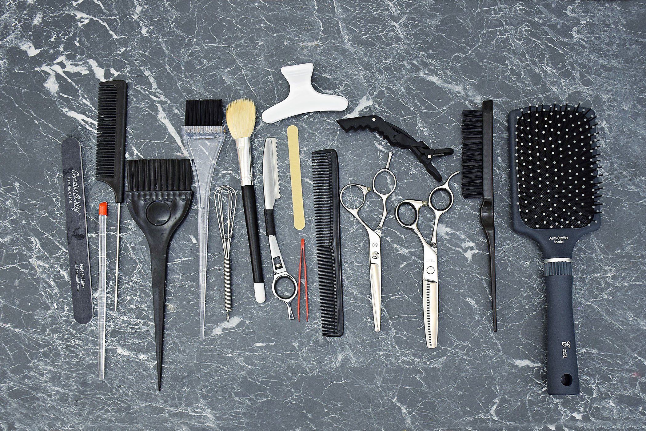 Hair styling tools are lined up on a table