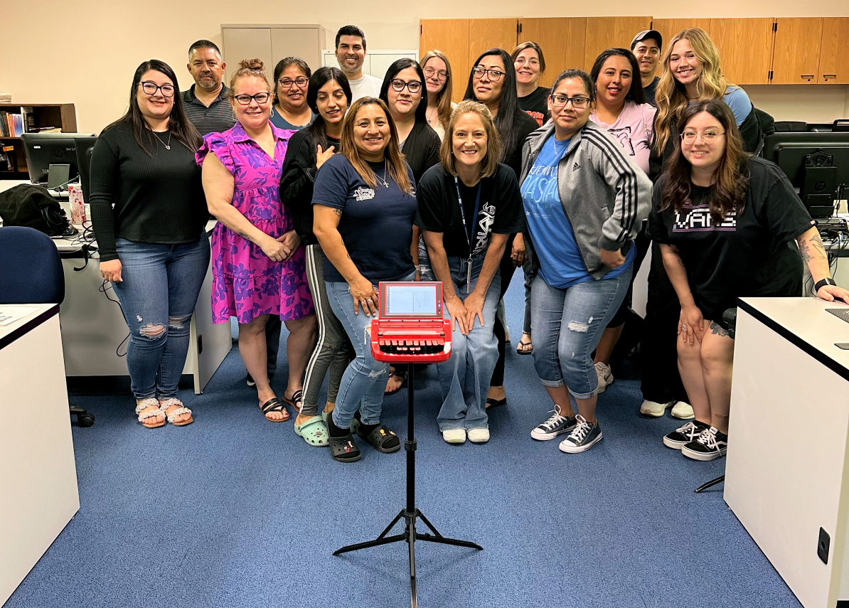 Project Steno students pose for a photo with a transcribing machine