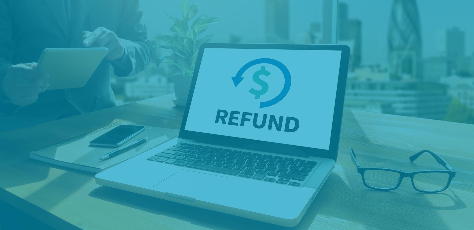 A laptop computer with REFUNDS on the screen