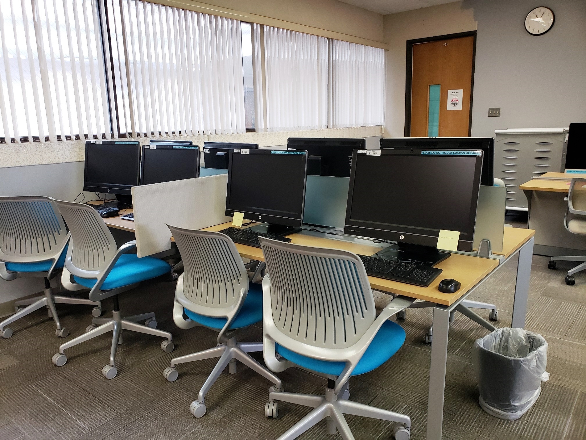 Group of eight desktop computers. 