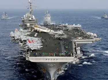 A navy ship convoy in the ocean