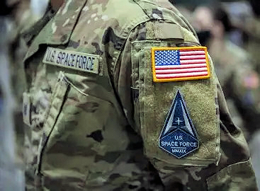A space force patch on the sleeve of a military uniform