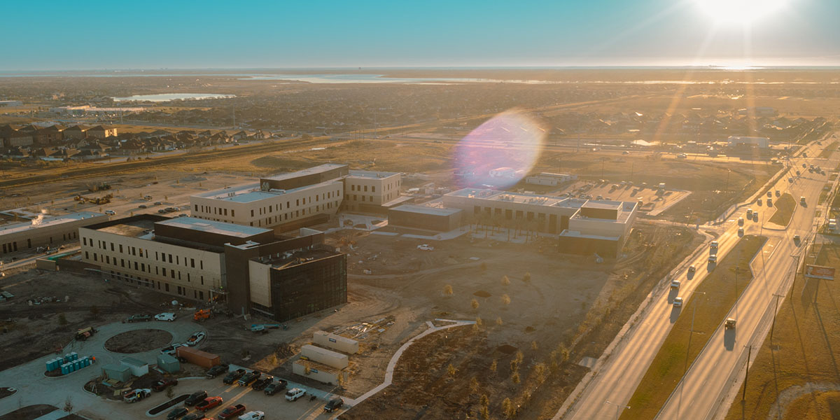 Aerial photo of Oso Creek Campus with sunrise in distance