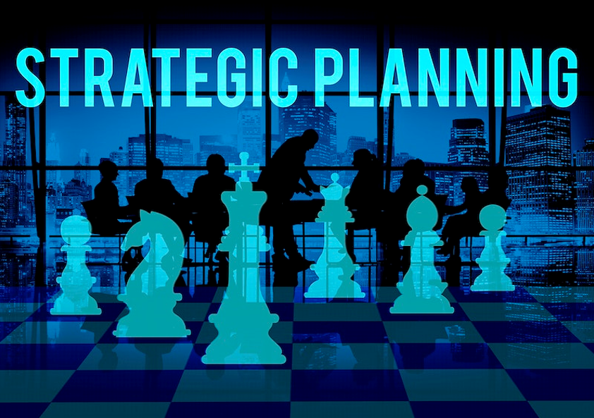 Chess board graphic with planning committee in the background with the words Strategic Planning above